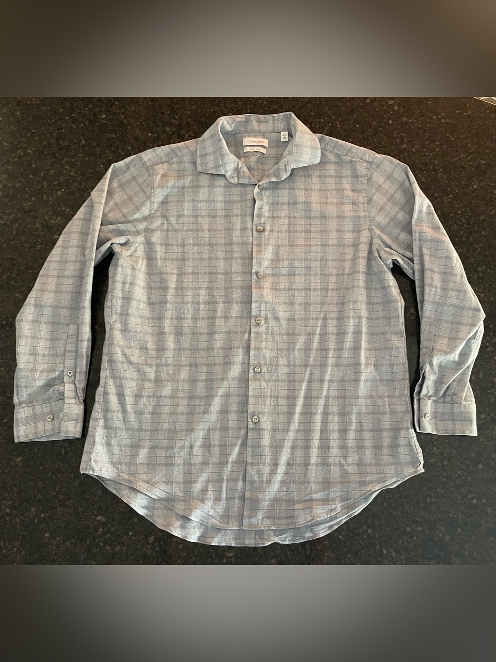 Calvin Klein men’s button up shirt, large slim fit. Light blue plaid print.